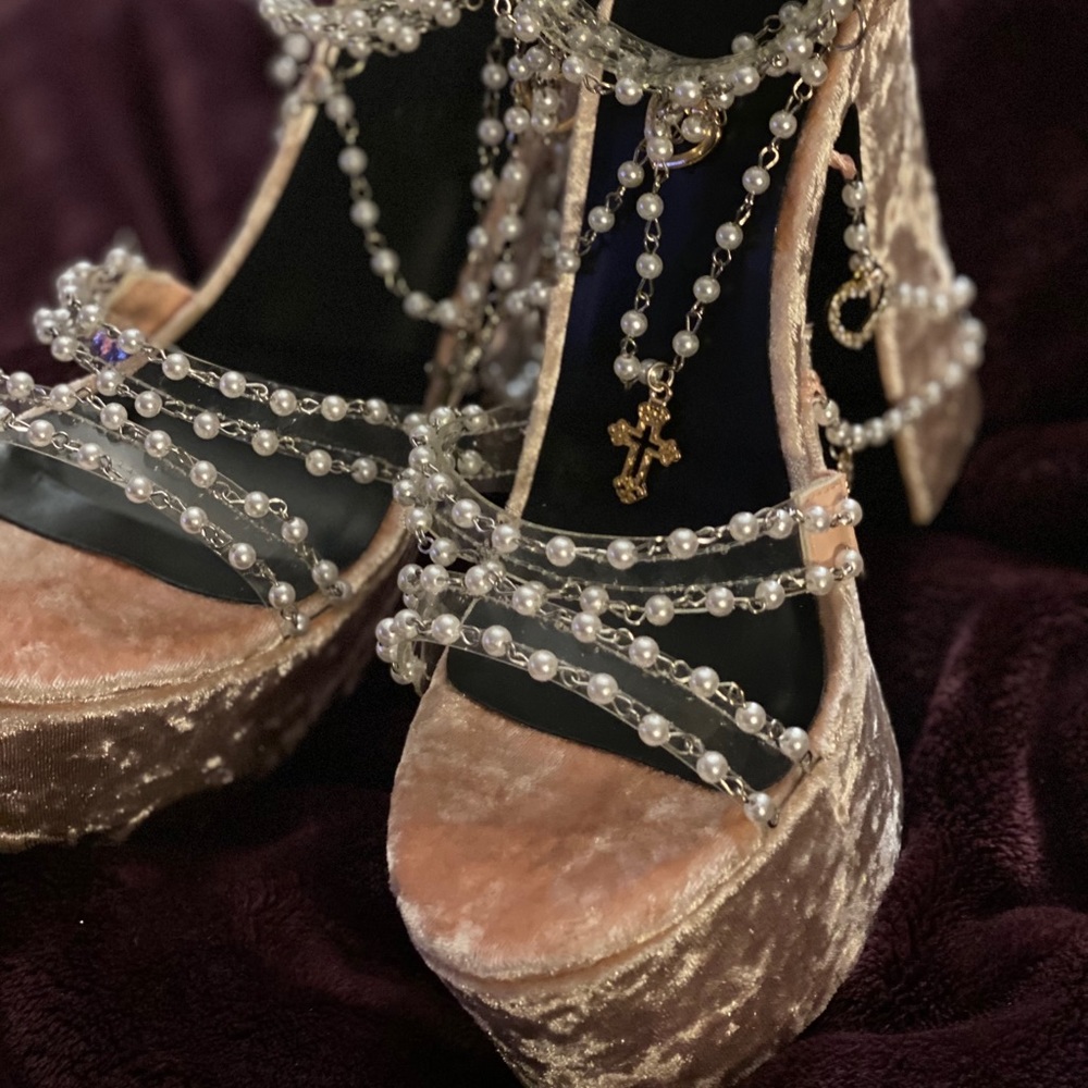 Woman’s beautiful velvet pink platforms